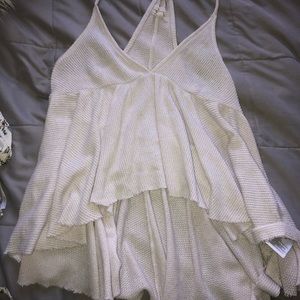 white shirt that is longer in the back